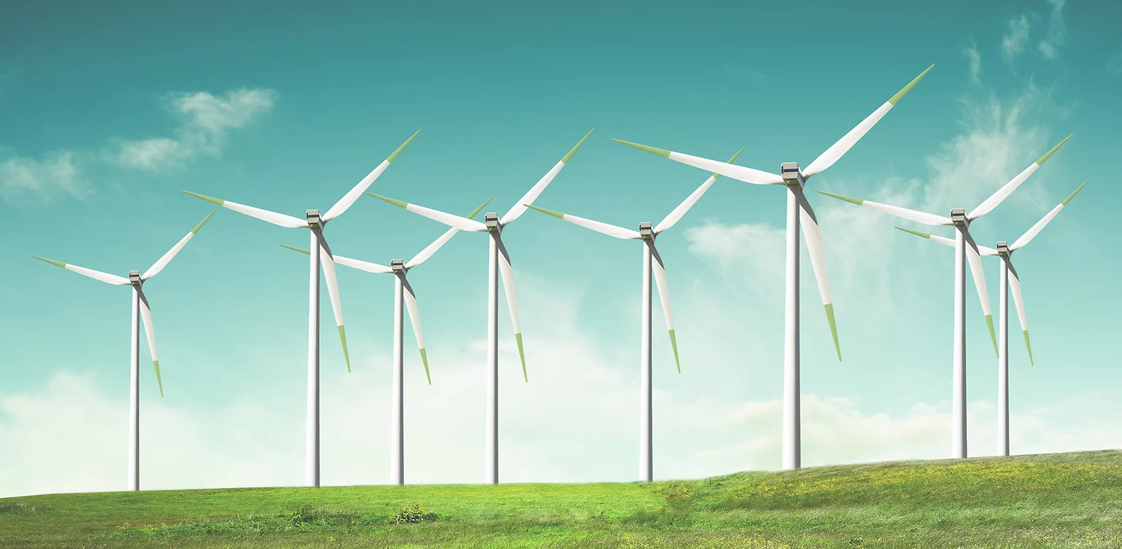 Windmills on green field